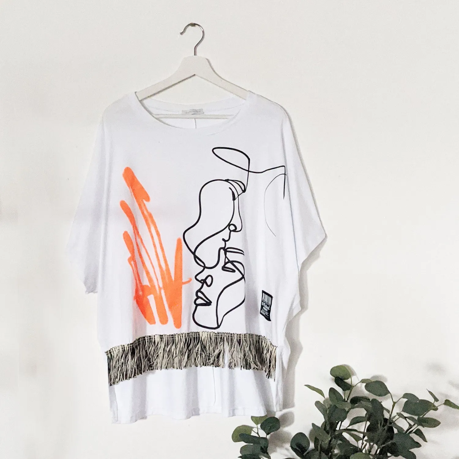 Edgy dual portrait outline top with horizontal fringe detail